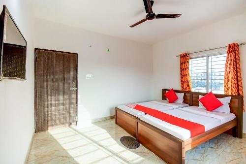 Postel nebo postele na pokoji v ubytování Hotel O Creation Premium