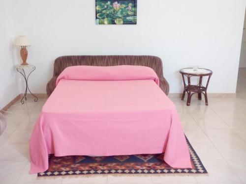 Ένα ή περισσότερα κρεβάτια σε δωμάτιο στο Monolocale Birgi