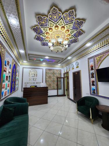 a lobby with a ceiling with a chandelier at People Tours Bukhara in Muruntau
