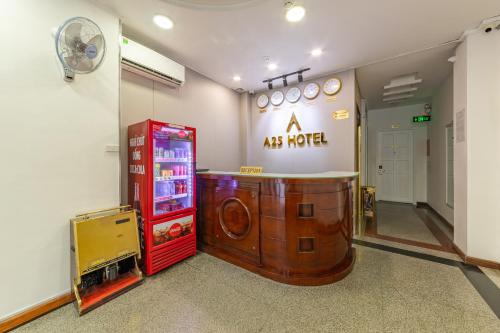 a room with a ak radio and a red machine at A25 Hotel - 22 Nguyễn Cư Trinh in Ho Chi Minh City