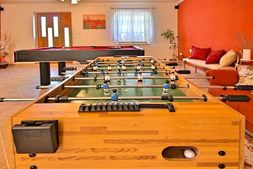 a room with a large billiard table and a pool table at Villa Angela e Giovanni in Vižinada