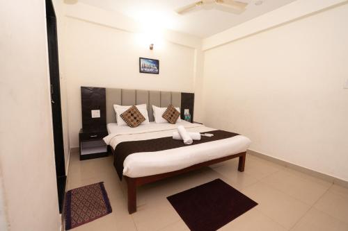 a bedroom with a large bed in a room at Hotel Baga inn in Baga