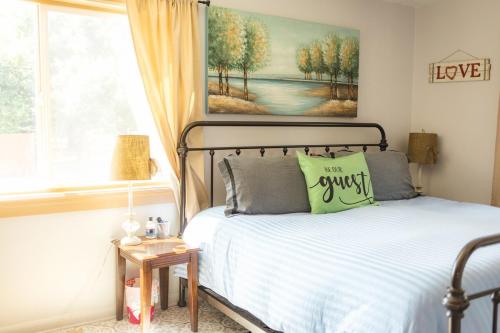 a bedroom with a bed and a window at Pet Friendly 6 Guest Stay w Yard in Billings