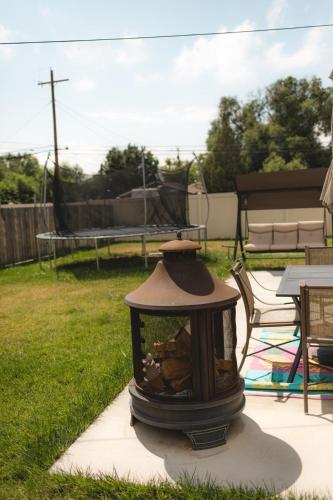 a fire hydrant sitting on a sidewalk in a yard at Pet Friendly 6 Guest Stay w Yard in Billings