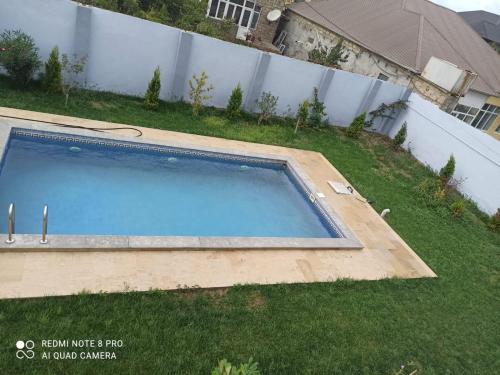Kolam renang di atau dekat dengan A two-storey cozy house with a pool