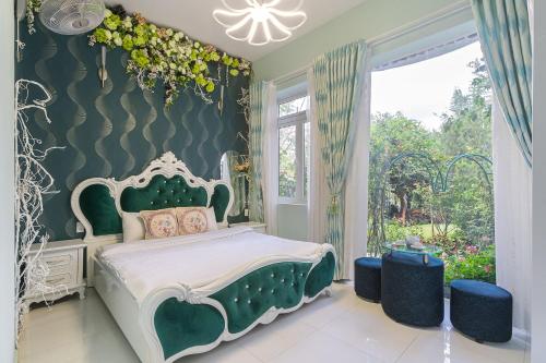 Dream Flower Dalat Hotelにあるベッド