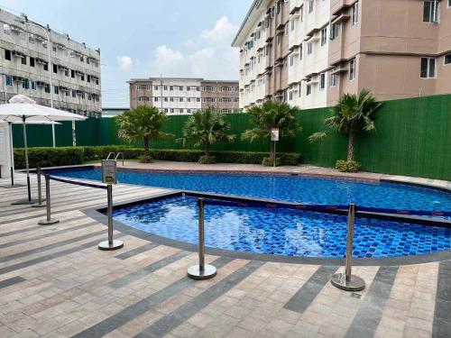 a large swimming pool in the middle of a building at The Pahina Suite in Marilao
