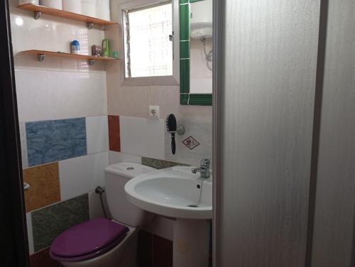a bathroom with a sink and a toilet at Casa para fines de semana cuevas del turche buñol in Buñol