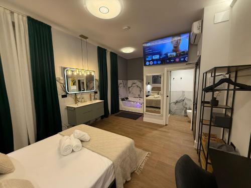 a room with two beds and a flat screen tv at Ventura Luxury in Alicante