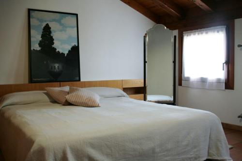 A bed or beds in a room at B&B Santa Fosca