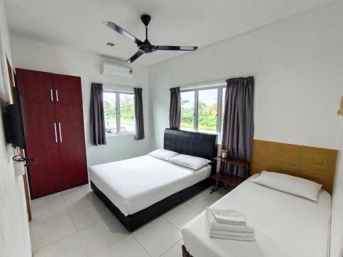 En eller flere senge i et værelse på Guesthouse Fasa 2B