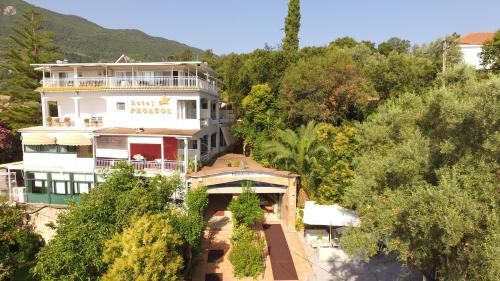 an aerial view of a building in the trees at Hotel Pegasos in Nikiana