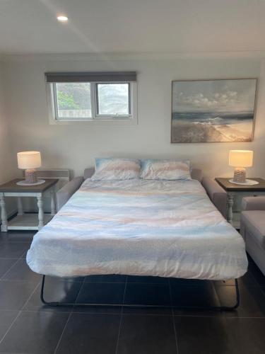 Ένα ή περισσότερα κρεβάτια σε δωμάτιο στο Esplanade Breeze Sunderland Bay
