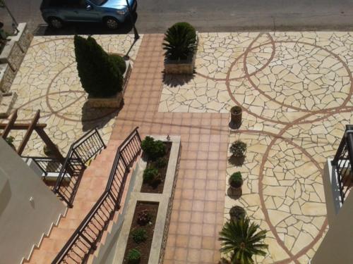 an aerial view of a patio with plants at Kandania Apartments in Kántanos