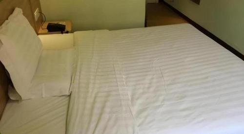 Ένα ή περισσότερα κρεβάτια σε δωμάτιο στο 7 Days Inn Deyang Zhongjiang Kuishan Park