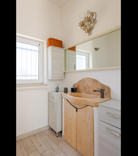 a kitchen with a sink and a counter top at Casa Relax - Bellavista Sauna & SPA by TrulloVista in Martina Franca
