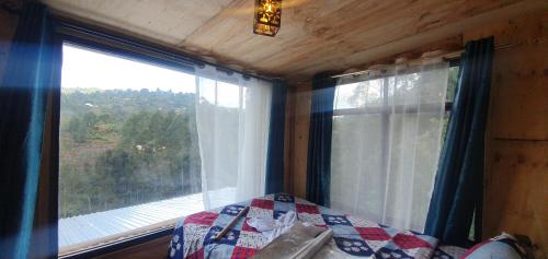 Giường trong phòng chung tại Lushoto Coffee Lodge