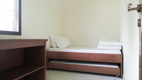 Кровать или кровати в номере Villa Dalia Puncak Nb3-8