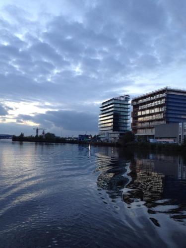 a large body of water with buildings in the background at Black Jack Suites in Amsterdam