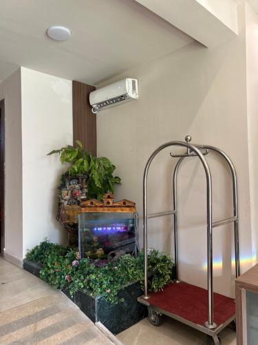 a fish tank in the corner of a room at Jewel Dokki Hotel in Cairo