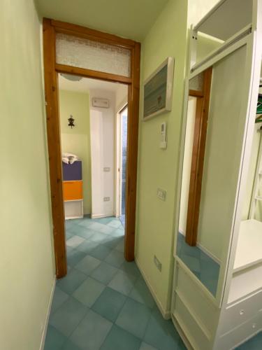 a hallway with a door to a room at Casa Fornaciari in Viareggio