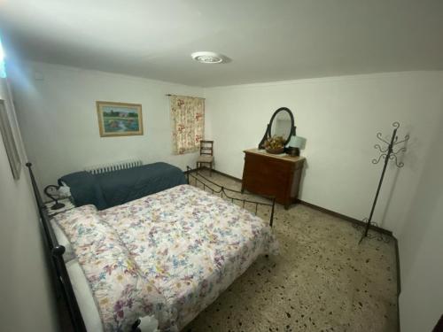 Ένα ή περισσότερα κρεβάτια σε δωμάτιο στο La Taverna