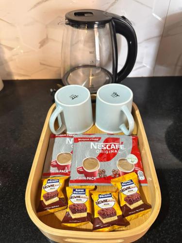 a tray with a tray of nescafe snacks and a blender at House in Davao in Davao City