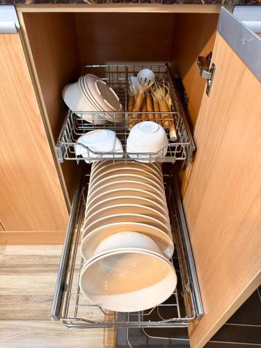 a drawer filled with plates and dishes in a kitchen at House in Davao in Davao City