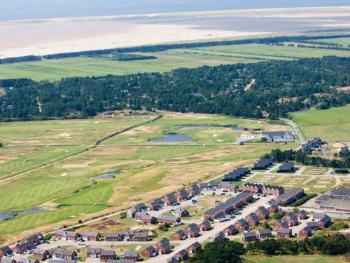 an aerial view of a village with houses and a lake at 6 person holiday home in Rømø in Rømø Kirkeby