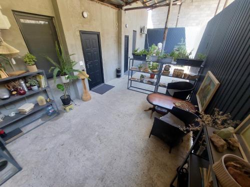 a living room with a room with plants on shelves at Komfort Ilona in Yerevan