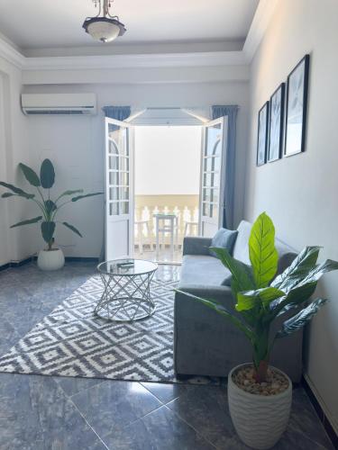a living room with a couch and a table at Qaitbay Citadel View in Alexandria