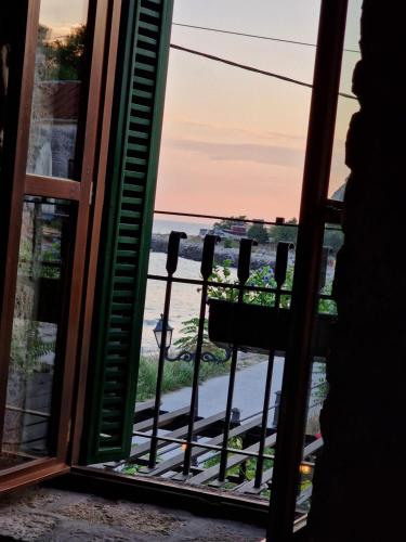 a view of the ocean from a window at Villa Bellavista in Kavarna