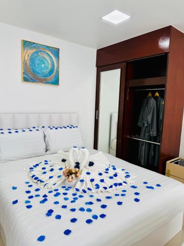 Ένα ή περισσότερα κρεβάτια σε δωμάτιο στο The Kris Residence