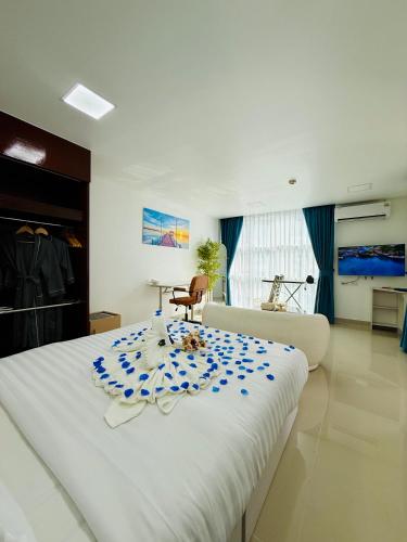 Ένα ή περισσότερα κρεβάτια σε δωμάτιο στο The Kris Residence