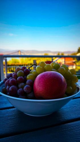 a bowl of fruit sitting on top of a table at Vila V & S in Star Dojran