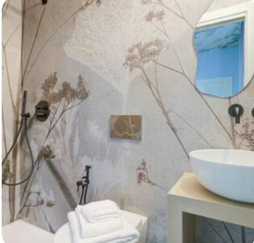 a bathroom with a shower and a sink and a toilet at Emozione Blu in Monte Marcello