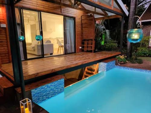 a house with a swimming pool in the backyard at African Diamond - Date Night Suite in Benoni