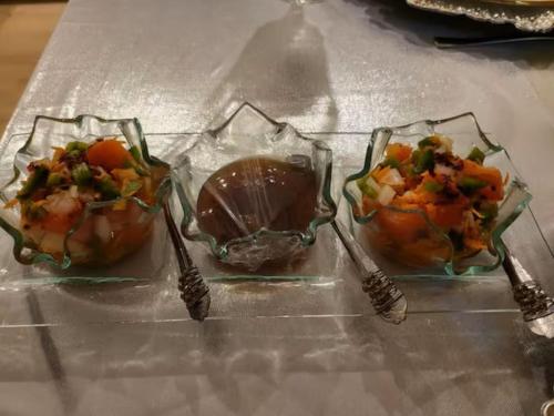 three dishes of food in plastic containers on a table at African Diamond - Date Night Suite in Benoni