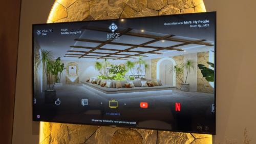 a picture of a living room on a wall at Hygge Hotel and Villas Seminyak in Seminyak