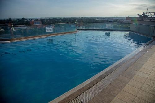 a large swimming pool on top of a building at Madaraka 1 Westpointe in Nairobi