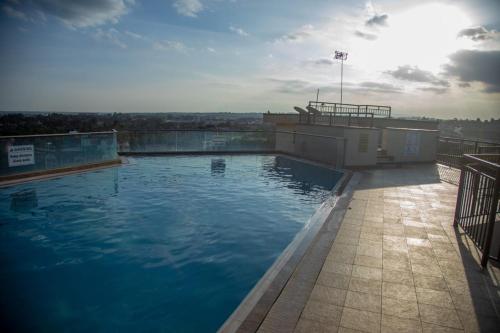 a large swimming pool on top of a building at Madaraka 1 Westpointe in Nairobi