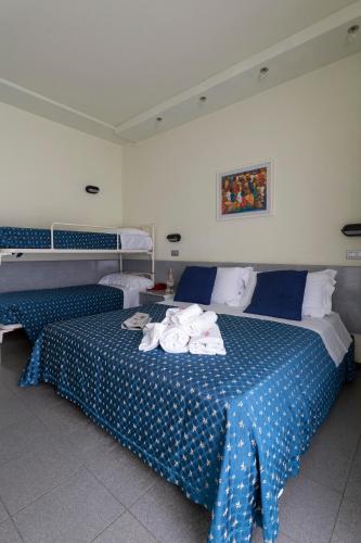 Postel nebo postele na pokoji v ubytování Hotel Reggiana
