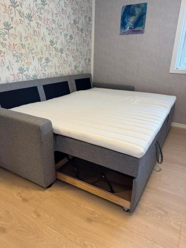 a bed in a room with a mattress on it at Bergtun's Corner - Sotra Vest in Sekkingstad