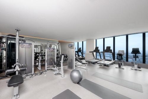 a gym with treadmills and exercise equipment in a building at OMO5 Yokohama Bashamichi by Hoshino Resorts in Yokohama