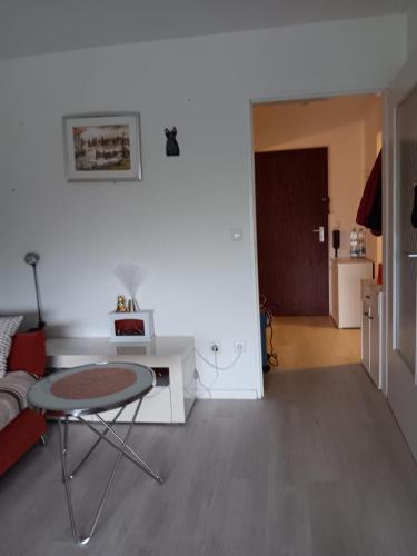 a living room with a table and a couch at Ferienwohnung Lona in Bad Reichenhall