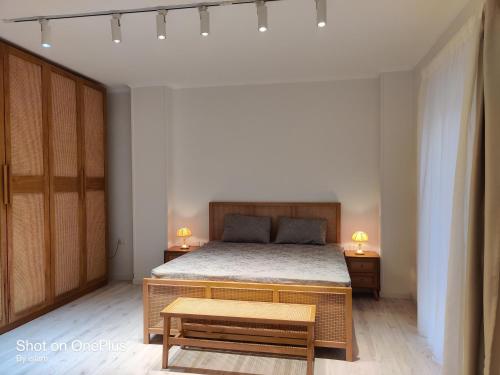 Una cama o camas en una habitación de Chic Boho Vibes Apart -Smart Home 2BR - New Cairo - Family only retreat