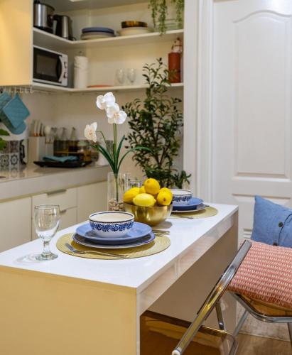 a kitchen with a table with plates of food on it at Terracotta Cove 2BR Suite, SM Seaside, Oceanpark in Cebu City