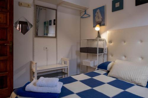 Ένα ή περισσότερα κρεβάτια σε δωμάτιο στο Vivienda Vacacional TINIZARA