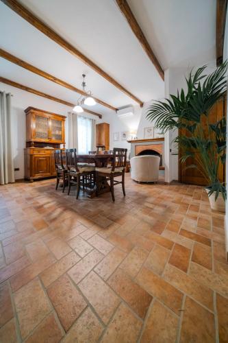 a dining room with a table and chairs and a fireplace at Domus Emma in Cantalupo in Sabina