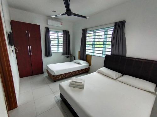 En eller flere senge i et værelse på Guesthouse Fasa 2B